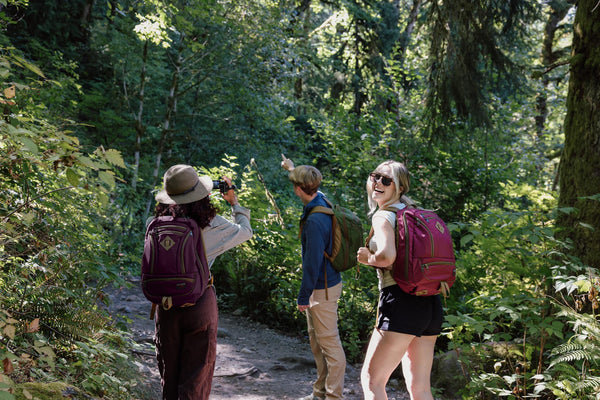 People on a hike with their Synik 26s